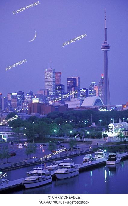 Skyline with CN tower at dusk with moon, Toronto, Ontario, Canada