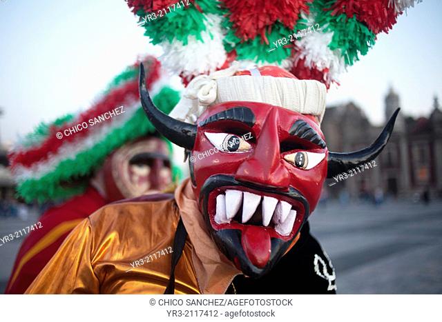 A dancer from Chocaman, Veracruz, dressed as a red devil, dances the Danza de los Santiagos at the pilgrimage to Our Lady of Guadalupe Basilica in Mexico City