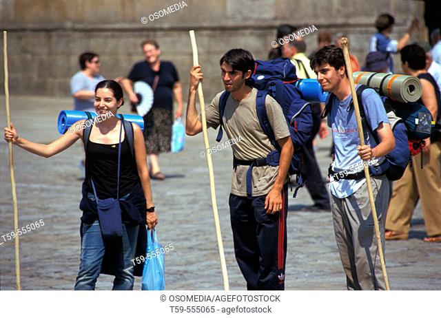 Young pilrgims in front of cathedral at Santiago de Compostela, Spain