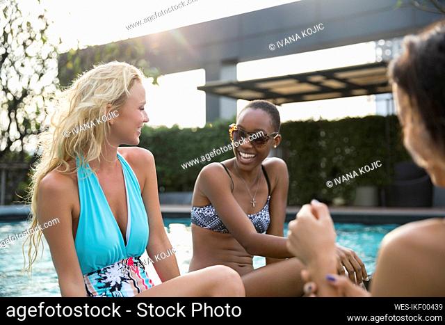 Happy multiracial friends having fun at resort