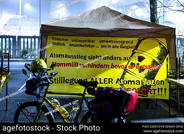15 April 2023, Lower Saxony, Lingen: In front of the site of the nuclear power plant Emsland there is a pavilion and a banner with the inscription: ""Nuclear...