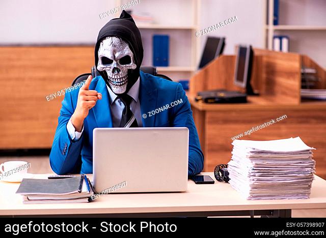 Devil businessman employee working in the office