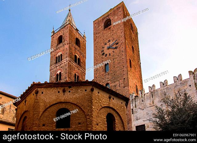 The belfry of the Cathedral and the Clock Tower, medieval landmarks in the old town of the ligurian village of Albenga