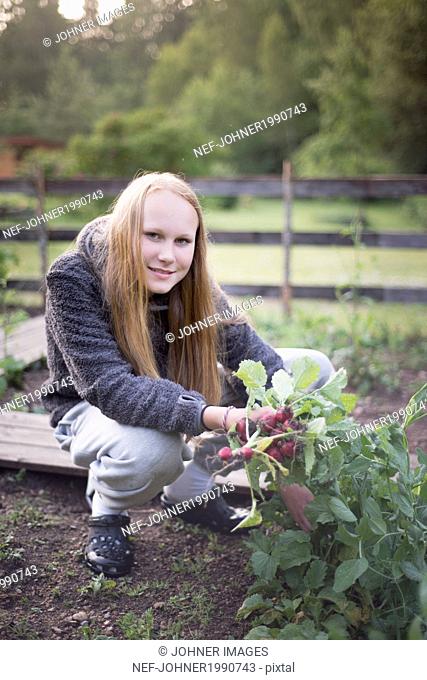Teenage girl in garden