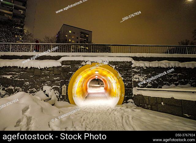 Stockholm, Sweden A yellow pedestrian tunnel in the snow in pedestrian in the Fruangen suburb