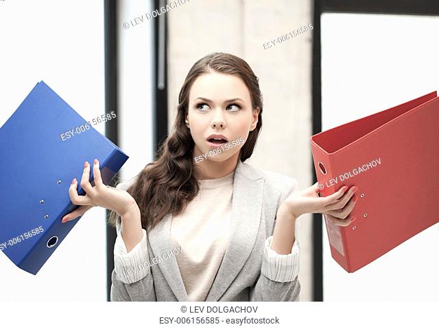 business concept - unsure thinking or wondering woman with folder