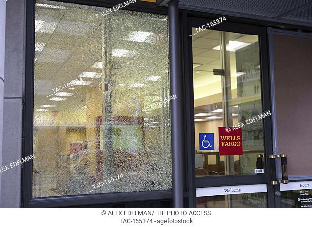 A smashed window at Wells Fargo bank branch during the inauguration of United States President Donald J. Trump in Washington, DC on January 20, 2017