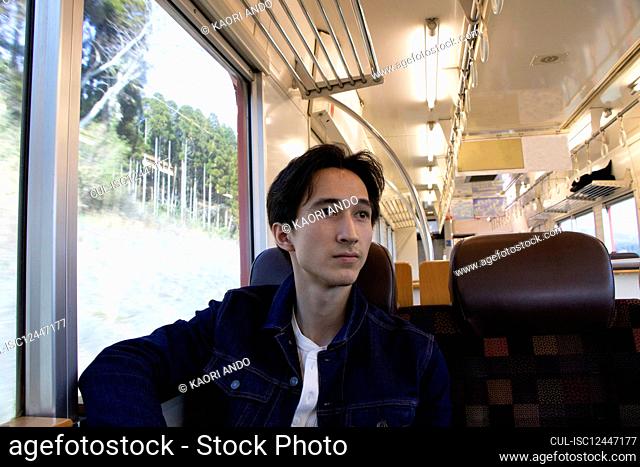 Man traveling on passenger train