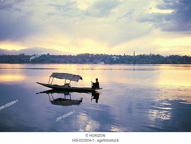 Man boating in a lake at Srinagar, Kashmir