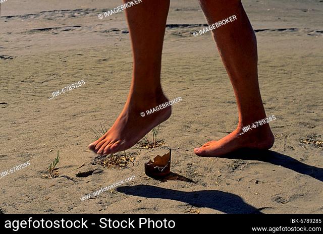Shard, bottom of bottle on beach, barefoot