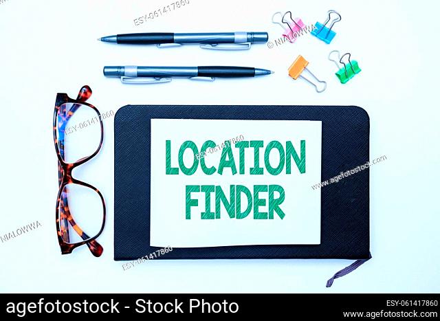 Conceptual display Location Finder, Word Written on A service featured to find the address of a selected place Office Supplies Over Desk With Keyboard And...