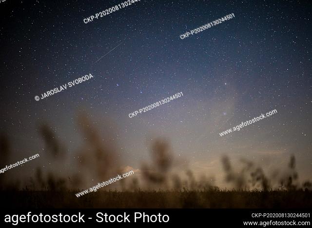 The 2020 Perseid meteor shower, upper left, is seen over landscape near Jivova village, Olomouc Region, Czech Republic, at night on August 13, 2020