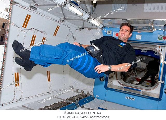 Astronaut Greg Chamitoff, Expedition 17 flight engineer, floats in the newly installed Kibo Japanese Pressurized Module of the International Space Station while...