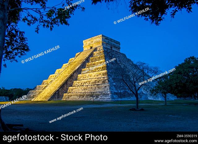 View of El Castillo (Temple of Kukulcan), the great Mayan pyramid, at night during the sound and light show in the Chichen Itza Archaeological Zone (UNESCO...