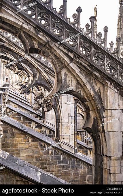Detail of flying buttresses and pinnacles. Exterior of the 14th century Milan Cathedral (Duomo di Milano) in Milan, Italy, Europe