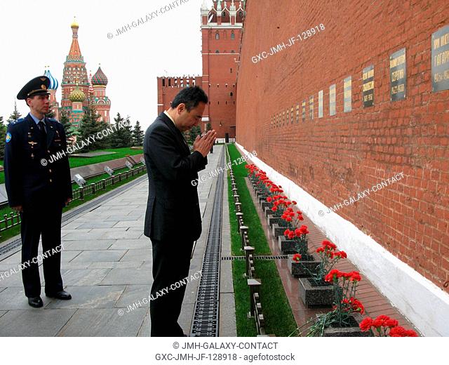 Japan Aerospace Exploration Agency astronaut Satoshi Furukawa, Expedition 28 flight engineer, pays his respects to those interred in the Kremlin Wall in Red...