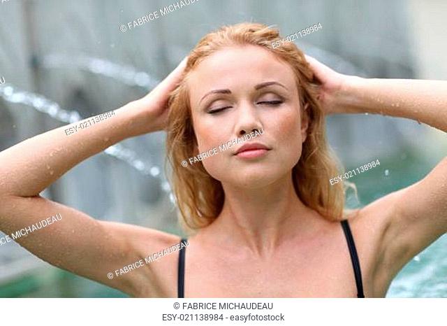Closeup of blond woman in spa pool