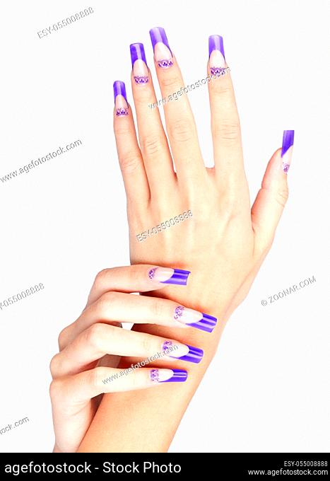 Hands with blue french acrylic nails manicure and painting isolated on white background