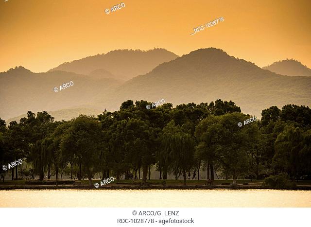 Hills at West Lake at sunset, Xihu, Hangzhou, Zhejiang Province, China, Asia