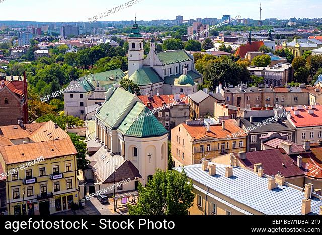 Lublin, Lubelskie / Poland - 2019/08/18: Panoramic view of historic old town quarter with St. Peter Apostle church and Conversion of St. Paul church