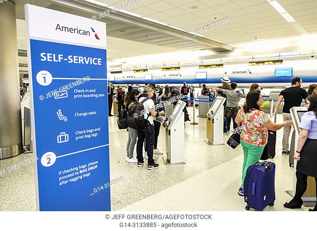 Florida, Miami, International Airport MIA, terminal concourse gate area, American Airlines, self-service check-in, kiosk, instruction poster