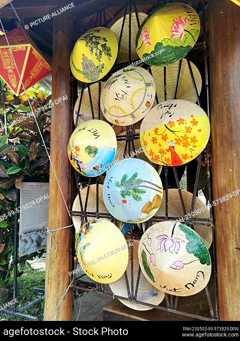 03 March 2023, Vietnam, Hue: Traditional Vietnamese hats, called Non La, are for sale for tourists at the Hue Citadel. Hue Citadel was the former residence of...