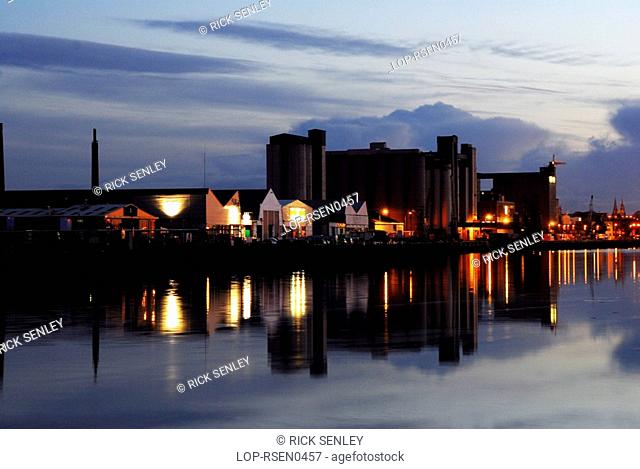 Republic of Ireland, County Cork, Docks, View across the water to the illuminated docks of Cork
