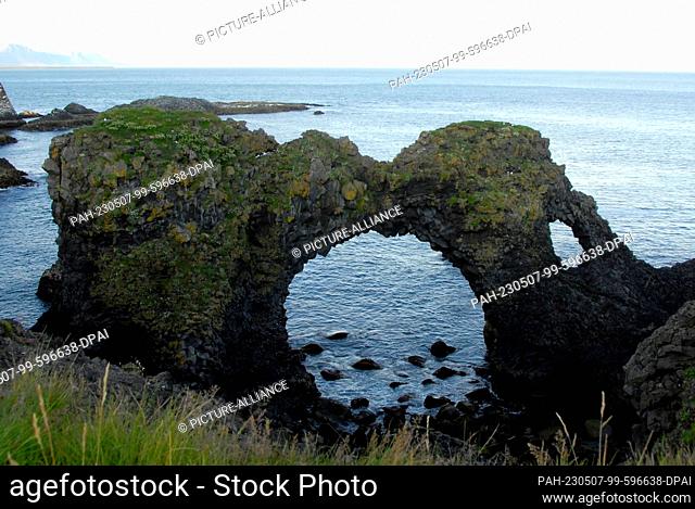 23 July 2022, Iceland, Arnarstapi: The Gatklettur arch is near the small fishing village of Arnarstapi on Snaefellsnes Peninsula in Iceland