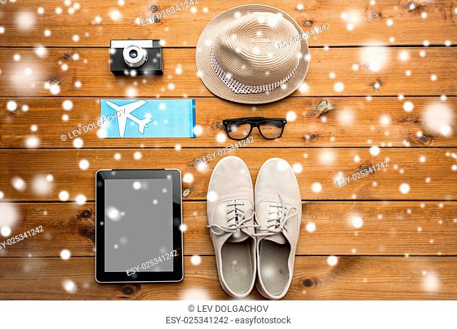 vacation, travel, tourism, winter holidays and objects concept -gadgets and traveler personal stuff