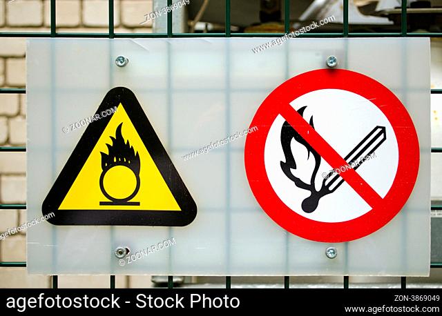 Fire warning signs near compressed oxygen gas cylinders