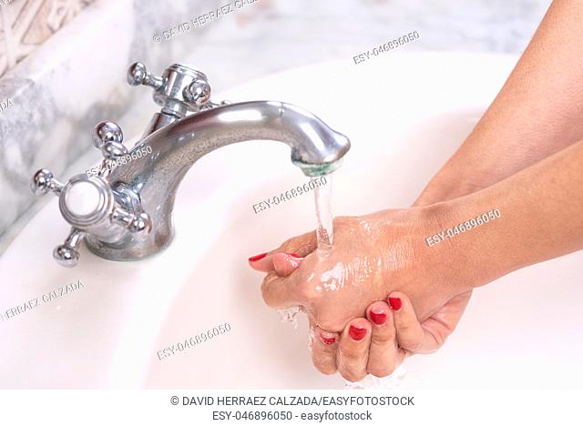 Young woman washing hands, cleaning hands Hygiene