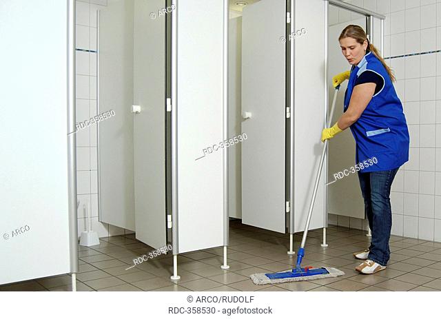 Cleaning lady, charwoman, cleaning power, toilet attendant, mopping floor, men's restroom, men's toilet, minor employment, cheap workforce, accommodation job