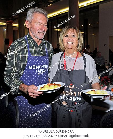 Former national soccer player Paul Breitner and his wife Hildegard supporting the Munchner Tafel e.V. ('Munich Food Bank') during the distribution of food in...