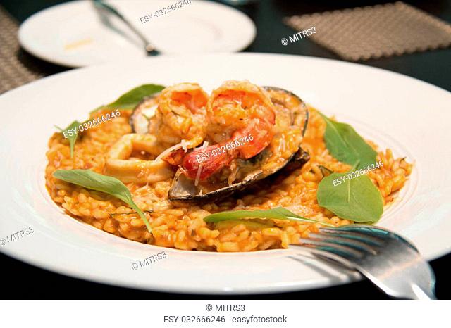 A Risotto, rice with seafood, food closeup