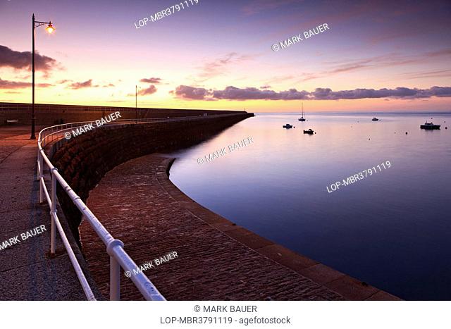 Channel Islands, Jersey, St Catherine. Dawn at St Catherine's breakwater, constructed in the mid 19th century originally as a refuge harbour for the Royal Navy