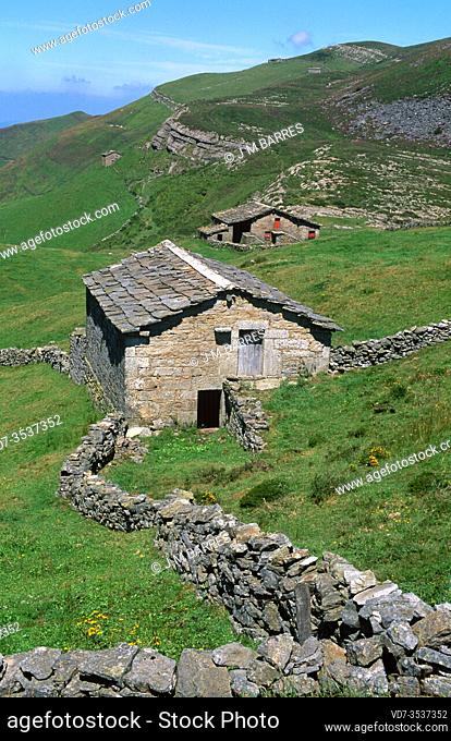 Pas Valley in direction to Puerto de las Estacas de Trueba. Stone cottages. Cantabria, Spain