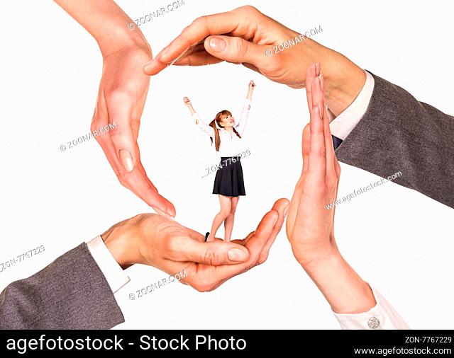Hands holding woman between palms over white background