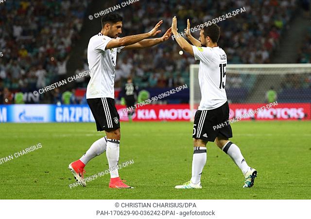 Germany's Amin Younes (R) celebrates with teammate Emre Can after giving his side a 4:1 lead during the Confederations Cup semi-final between Germany and Mexico...