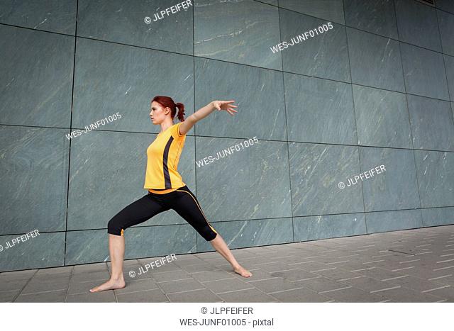 Young athlete stretching outdoors