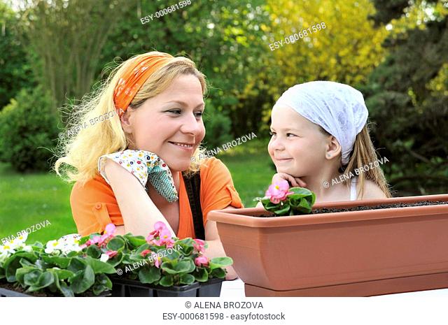 Mother, daughter having gardening time