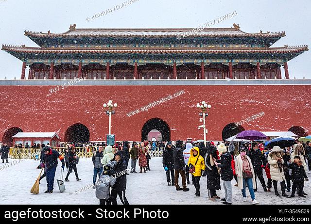 Tourists in front of Duanmen - Gate of Uprightness near the entrance to Forbidden City - palace complex in central Beijing, China