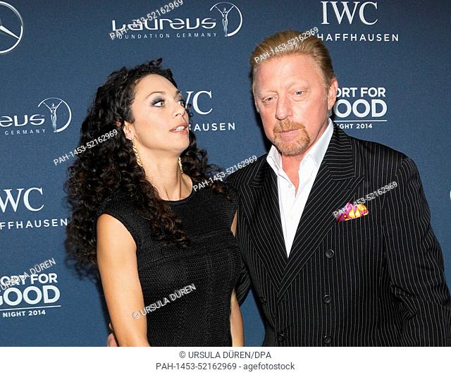 Former tennis pro Boris Becker (R) and his wife Lilly arrive for the Laureus Charity Gala in Munich, Germany, 19 September 2014