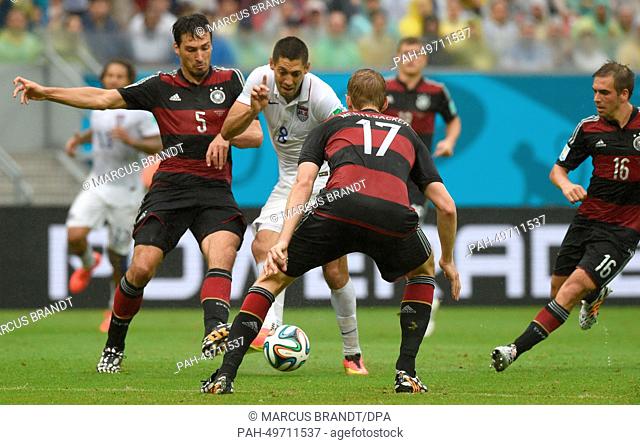 Clint Dempsey of the US vies for the ball with (L-R) Germany's Mats Hummels, Per Mertesacker and Philipp Lahm during the FIFA World Cup group G preliminary...