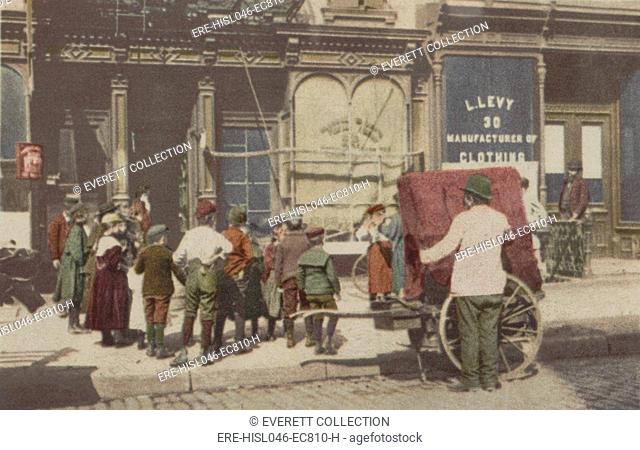 An organ grinder in the Italian quarter of New York City, 1902. Many New York Italian immigrants became street performers to support their families...