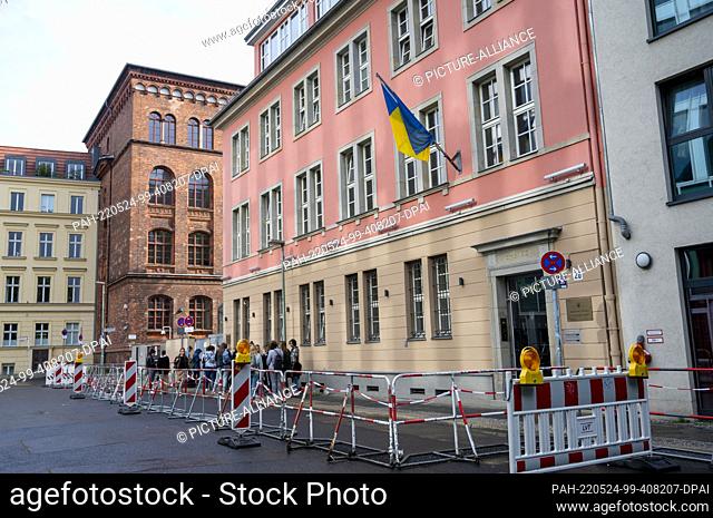 24 May 2022, Berlin: People stand in front of the Ukrainian Embassy. Three months ago, on February 24, Russia had launched a war of aggression against Ukraine