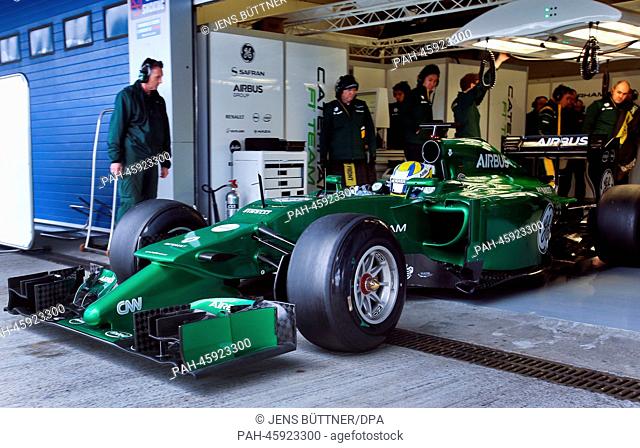 Swedish Formula One driver Marcus Ericsson of Caterham steers his the new car CT05 through the pit lane during the training session for the upcoming Formula One...