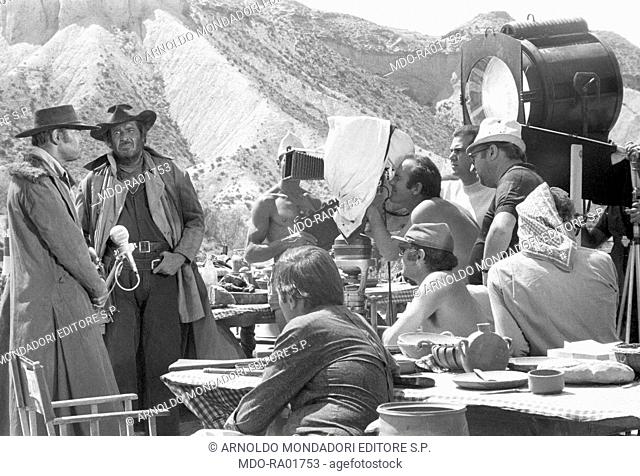 Italian director Sergio Leone directing American actors Henry Fonda and Jason Robards on the set of the film Once Upon a Time in the West. 1968
