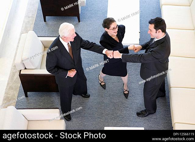 Elevated view of businesspeople smiling in an office