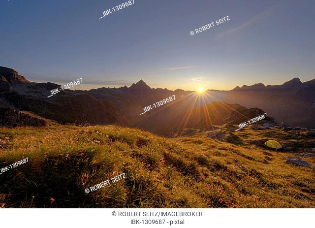 Sunrise with ridge and bivouac tent, Hinterhornbach, Lechtal, Ausserfern, Tyrol, Austria, Europe