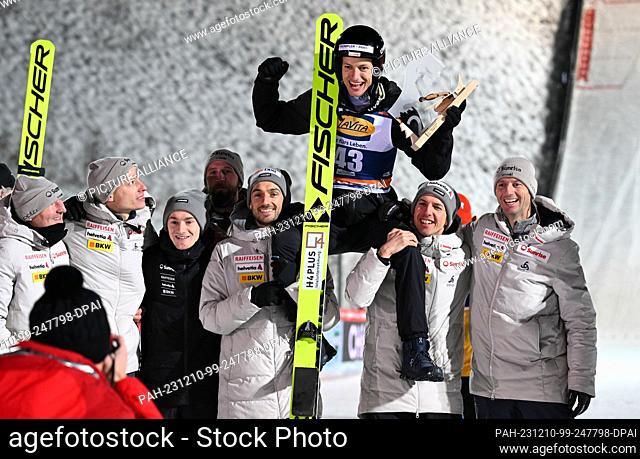 10 December 2023, Saxony, Klingenthal: Nordic skiing/ski jumping, World Cup, large hill, men, 2nd round. Gregor Deschwanden from Switzerland sits on the...